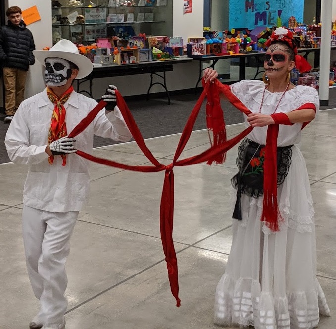 Salma Morales and Mario Ramirez, a Morton alum, participate in a ceremonial dance.