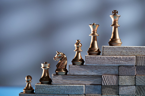 chess pieces on the wood stair by ranking