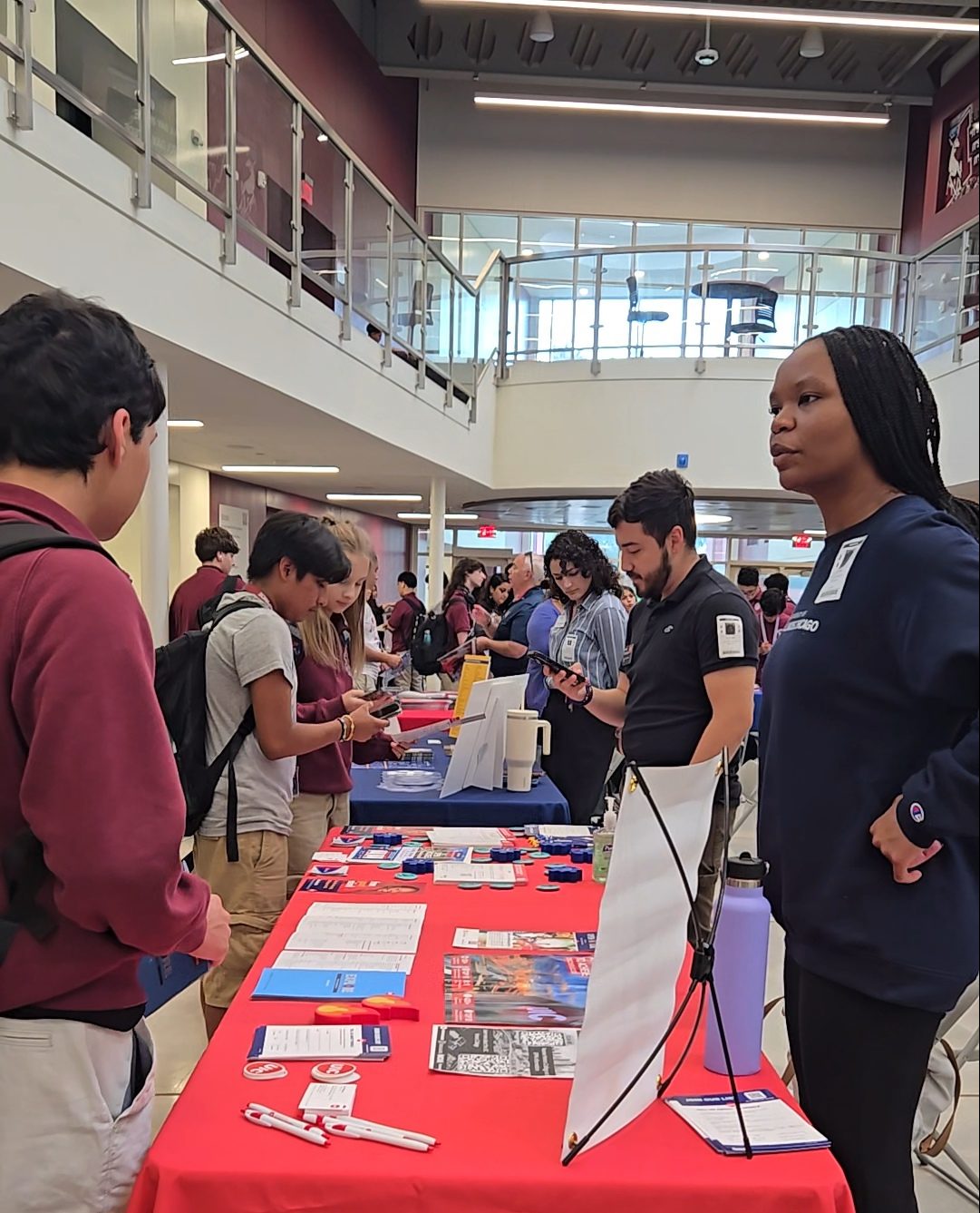 Students at Morton West's college fair speak with representatives from over 35 colleges from across the country on Sept. 20.