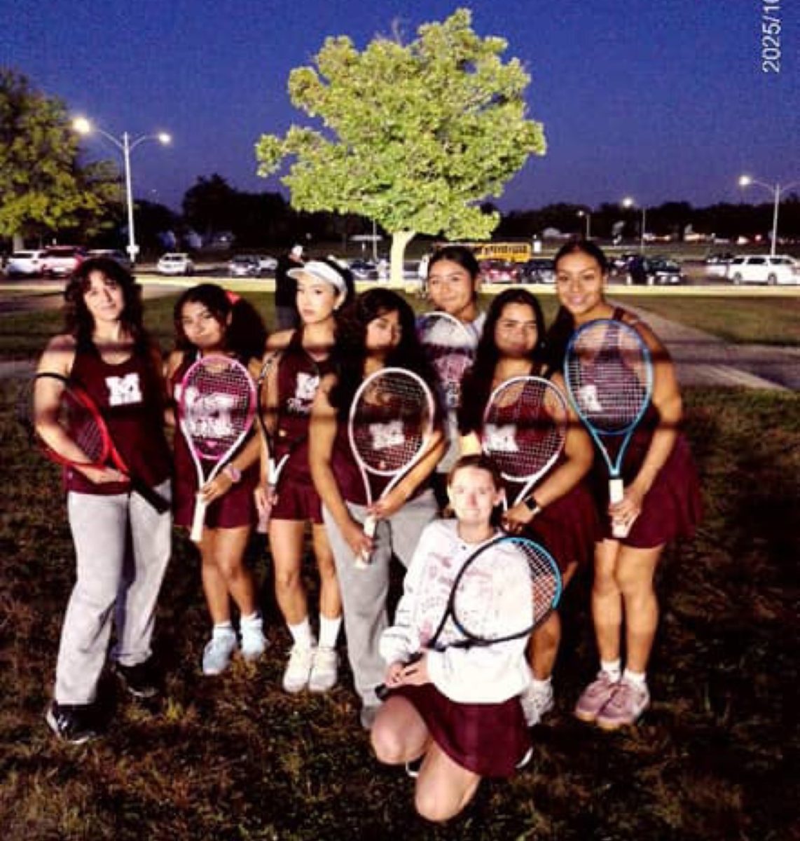 The girls' varsity tennis team at this year's conference tournament.